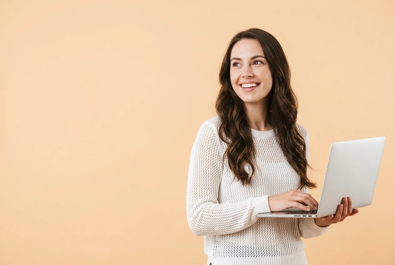 Email outreach services hero Smiling B2B professional with a laptop, representing cold email outreach services by Cheap Lead Generation